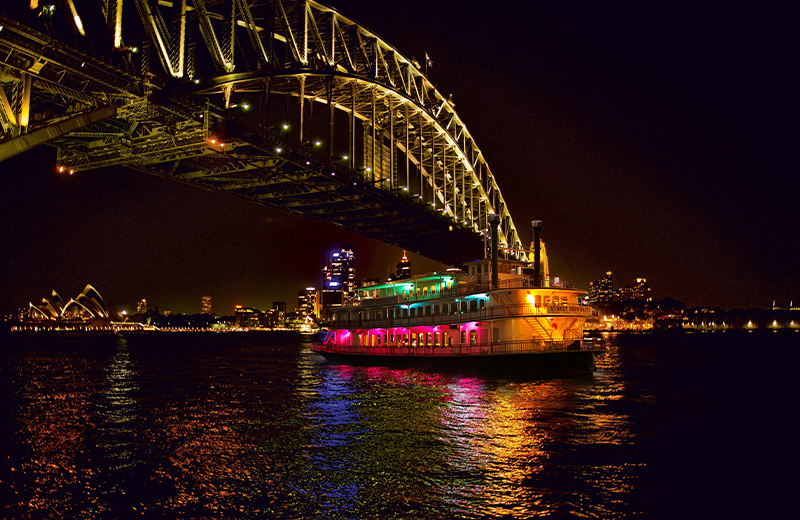 ‘Sydney Showboat II’ dinner cruise gliding past the Harbour Bridge