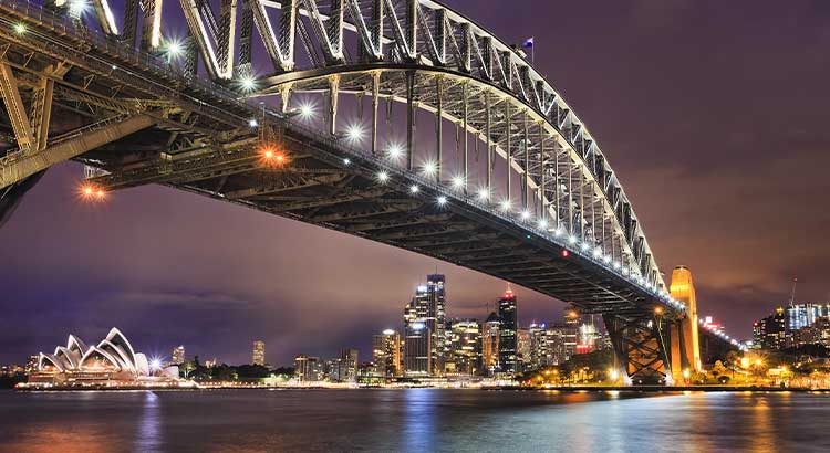 Stunning panorama of the Sydney Opera House and Harbour Bridge from a luxury dinner cruise.