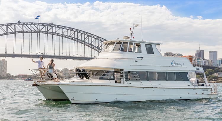 Relax on the outer decks of Fleetwing II, as it takes you past the illuminated harbour attractions.